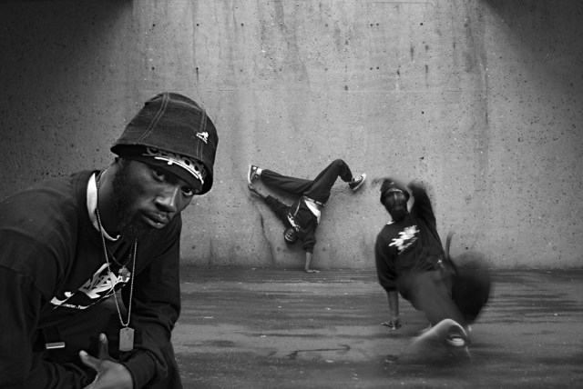 Soglo in triplicate demonstrating some b-boy moves