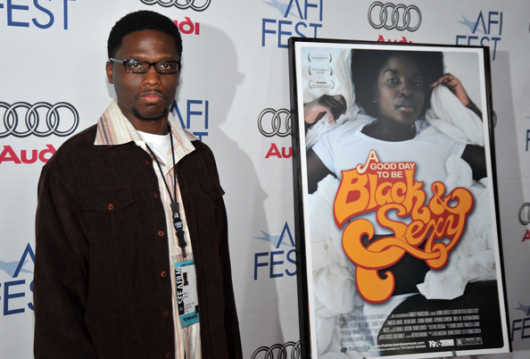 Dortch at AFI Fest beside the "Black & Sexy" poster, which features Nana Hill
