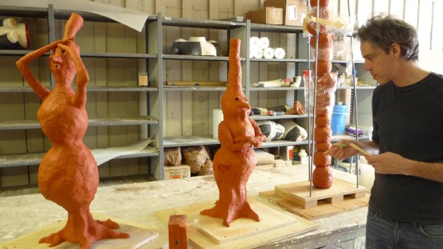 Conkle working on  clay models for the three bronze sculptures that make up "Burls will be Burls" (photo by Marne Lucas)