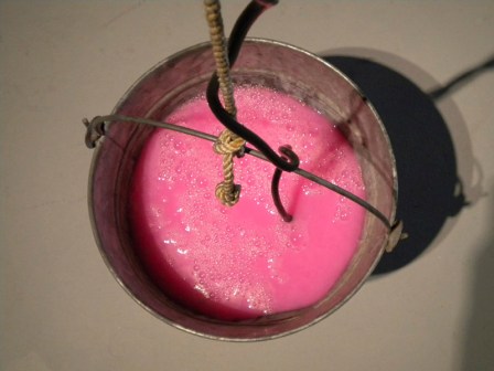 "Revolution" (galvanized pail, rope, pepto bismol, pump) from Bruce Conkle's 2010 show "Magic Chunks" (photo by Marne Lucas)