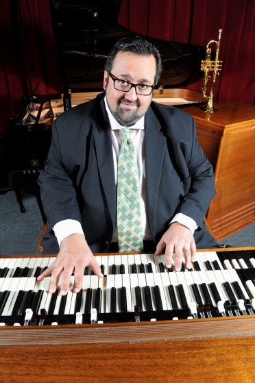 Joey DeFrancesco at the organ with a trumpet, which he began learning while on tour with Miles Davis, in the background (photo courtesy of Joey DeFrancesco)