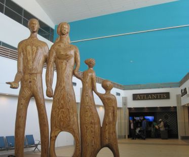 "The Family," a plywood sculpture by Maxwell Taylor at Lynden Pindling International Airport in Nassau, Bahamas (photo by Anita Malhotra)
