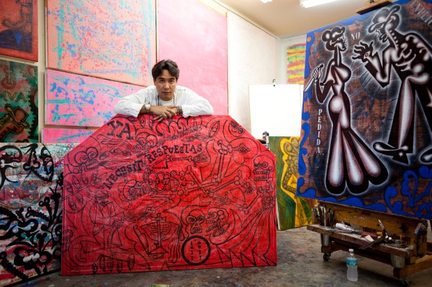 Carlos Luna in 2013 surrounded by his works at his studio (photo by Ignacio Barrios)
