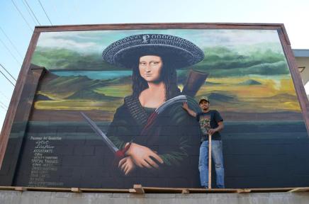 Ponce with his mural "Ramona Lisa," painted in June 2012 with the assistance of R@H and Kristy Sandoval (photo by Javier Martinez)