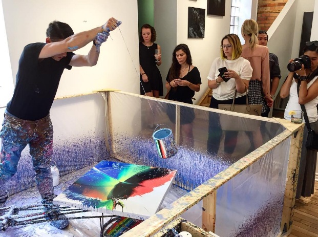 Schaub in a live painting performance (photo by Devan Patel of Artworks Consulting & Project Gallery)