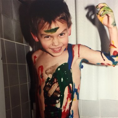 Callen Schaub as a child, covered in paint (photo by Janine Schaub)
