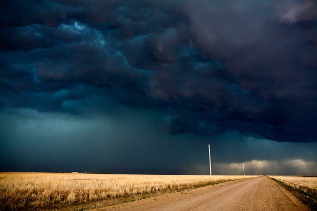 The Big Cloud: Rain over Fields of Gold, Kansas, 2008 (photo © Camille Seaman)